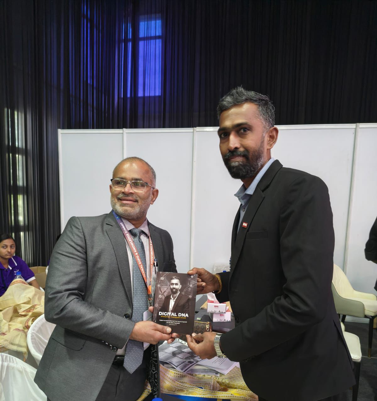 Selvakumar D presenting the Digital DNA book to BNI Coimbatore Executive Director in Coimbatore